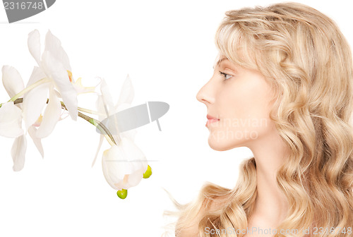 Image of beautiful woman with white flower