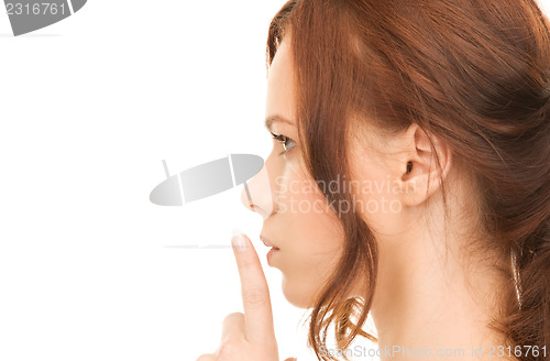 Image of finger on lips