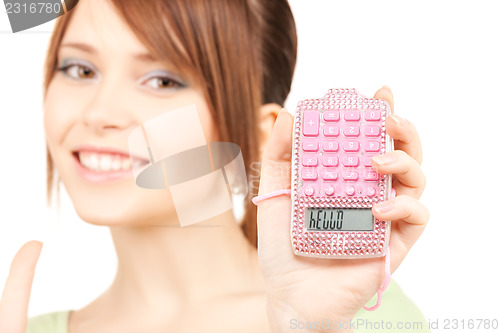 Image of lovely teenage girl with calculator