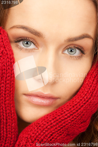 Image of beautiful woman in red mittens 