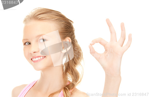 Image of lovely girl showing ok sign