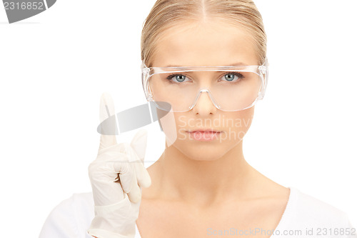 Image of woman in protective glasses and gloves