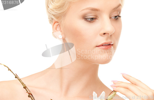Image of lovely woman with twig