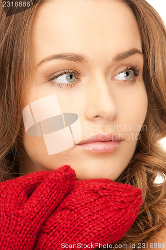 Image of beautiful woman in red mittens 
