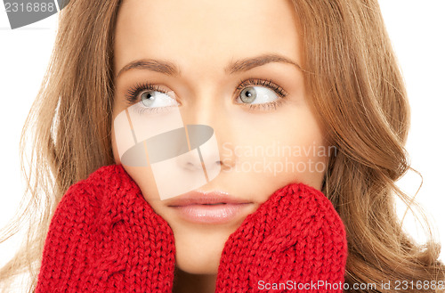 Image of beautiful woman in red mittens 