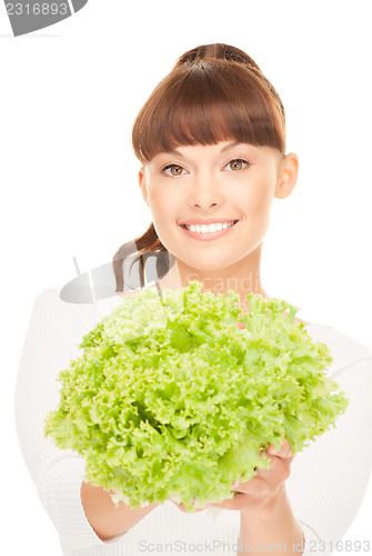 Image of beautiful housewife with lettuce over white