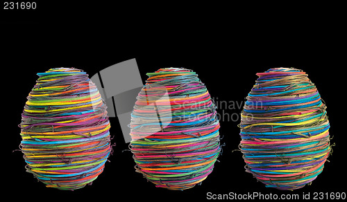 Image of three eggs on black