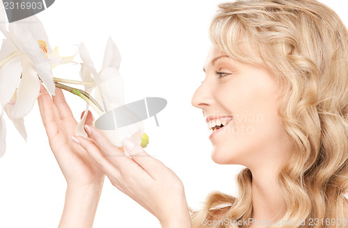 Image of beautiful woman with white flower