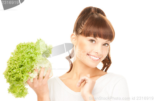 Image of beautiful housewife with lettuce over white