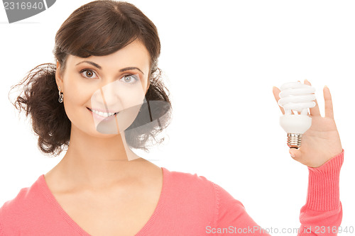 Image of woman holding energy saving bulb