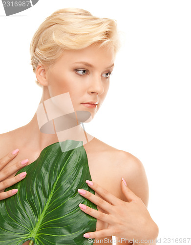 Image of woman with green leaf