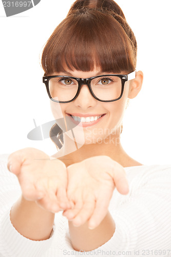 Image of woman showing something on the palms of her hands
