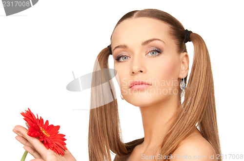 Image of woman with red flower