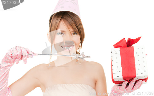 Image of teenage party girl with magic wand and gift box