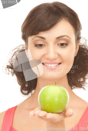 Image of young beautiful woman with green apple