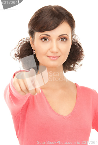 Image of attractive businesswoman pointing her finger