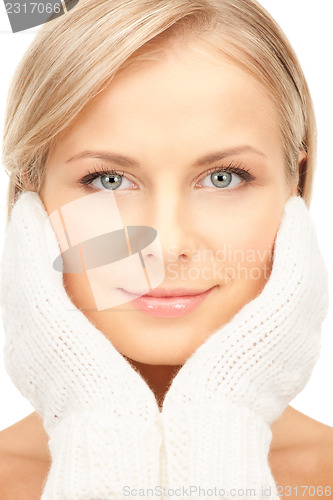 Image of beautiful woman in white mittens