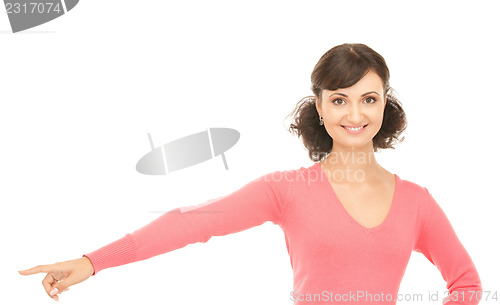 Image of attractive businesswoman pointing her finger