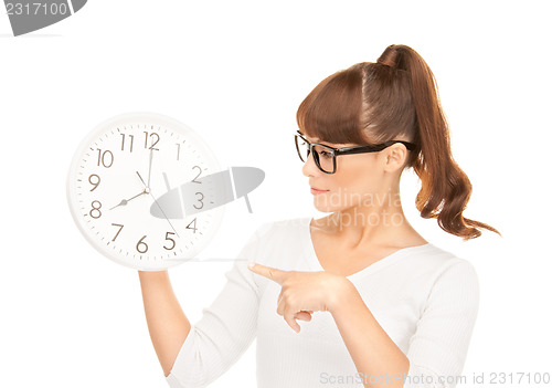 Image of woman holding big clock