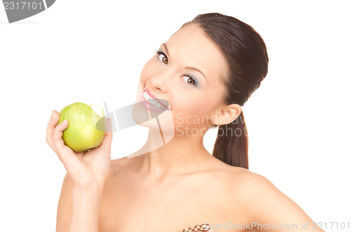 Image of young beautiful woman with green apple