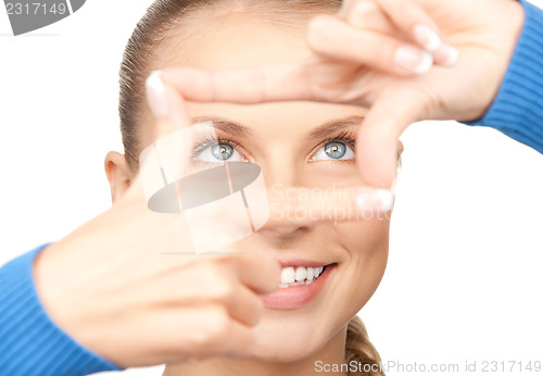 Image of lovely woman creating a frame with fingers