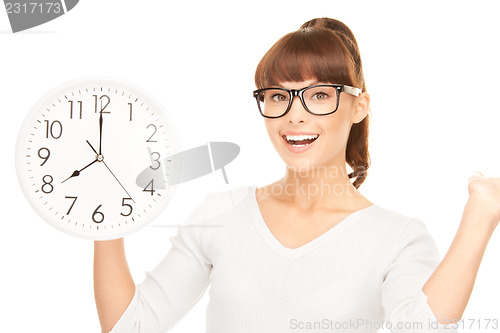 Image of woman holding big clock