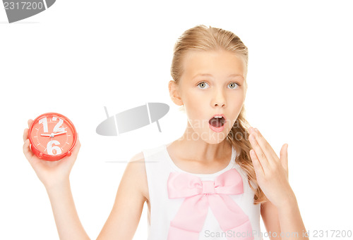 Image of girl holding alarm clock