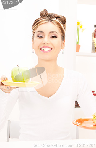 Image of woman with green apple and sandwich