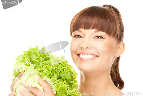 Image of beautiful housewife with lettuce over white