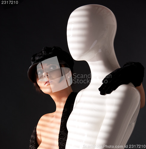 Image of woman with mannequin