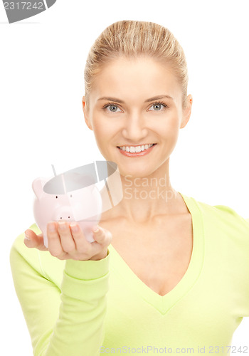 Image of woman with piggy bank