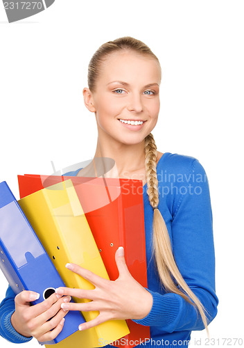 Image of young attractive businesswoman with folders