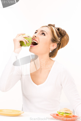 Image of woman with green apple and sandwich