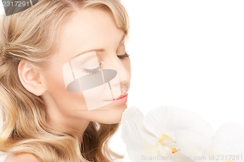 Image of beautiful woman with white flower