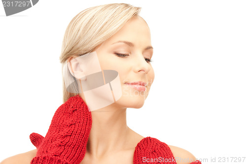 Image of beautiful woman in red mittens 