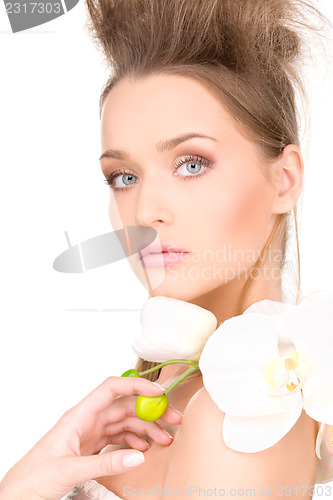 Image of beautiful woman with white flower