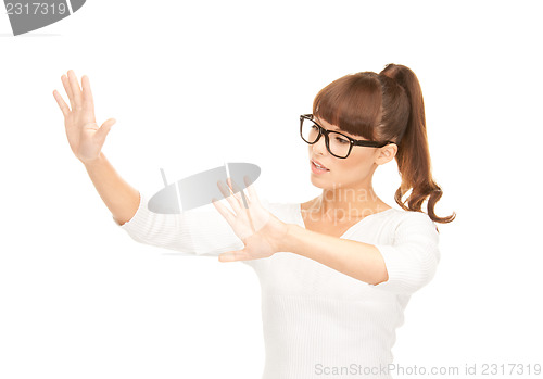 Image of businesswoman working with something imaginary
