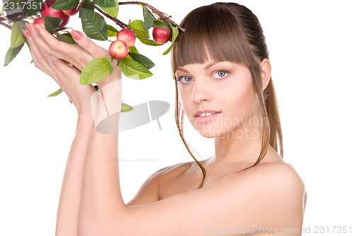Image of lovely woman with apple twig