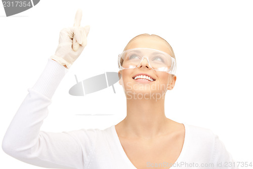 Image of woman in protective glasses and gloves