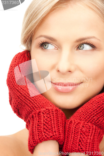Image of beautiful woman in red mittens 