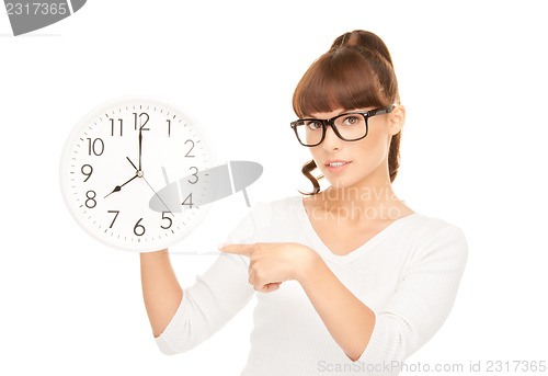 Image of woman holding big clock