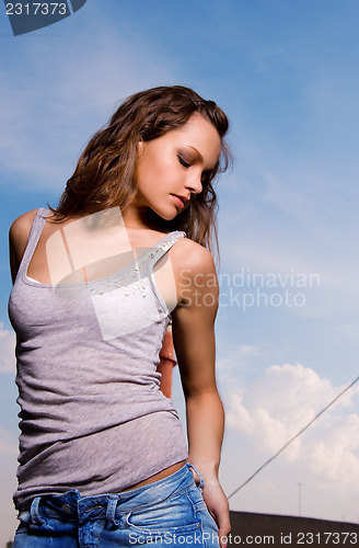 Image of young sexy woman in blue jeans