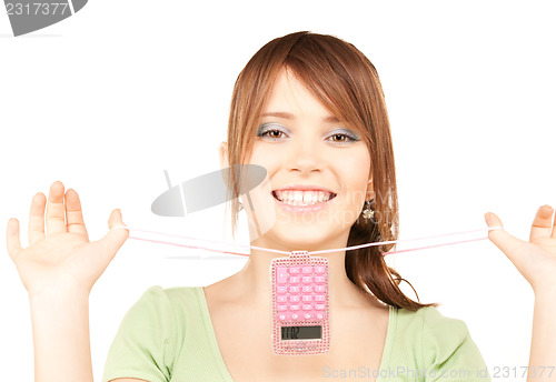 Image of lovely teenage girl with calculator