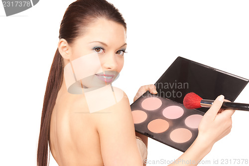Image of lovely woman with palette and brush