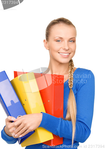 Image of young attractive businesswoman with folders