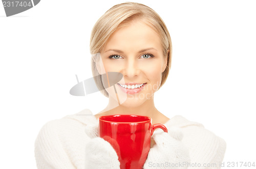 Image of beautiful woman with red mug