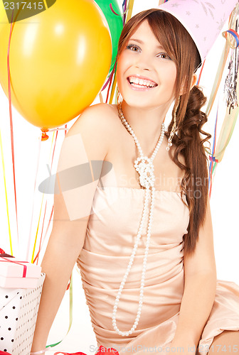 Image of party girl with balloons and gift box