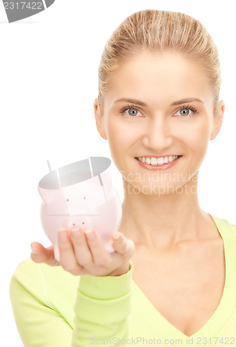 Image of woman with piggy bank