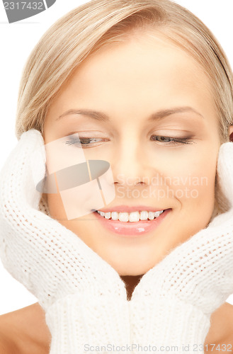 Image of beautiful woman in white mittens 