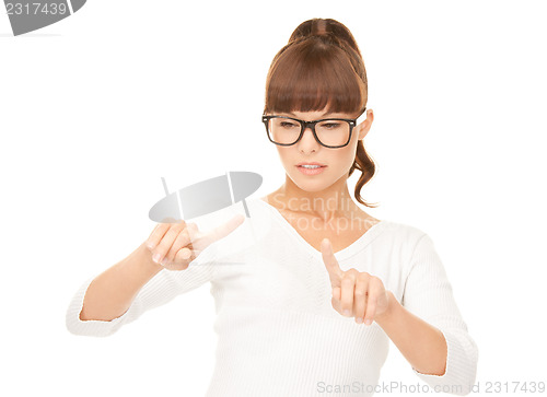 Image of businesswoman working with something imaginary
